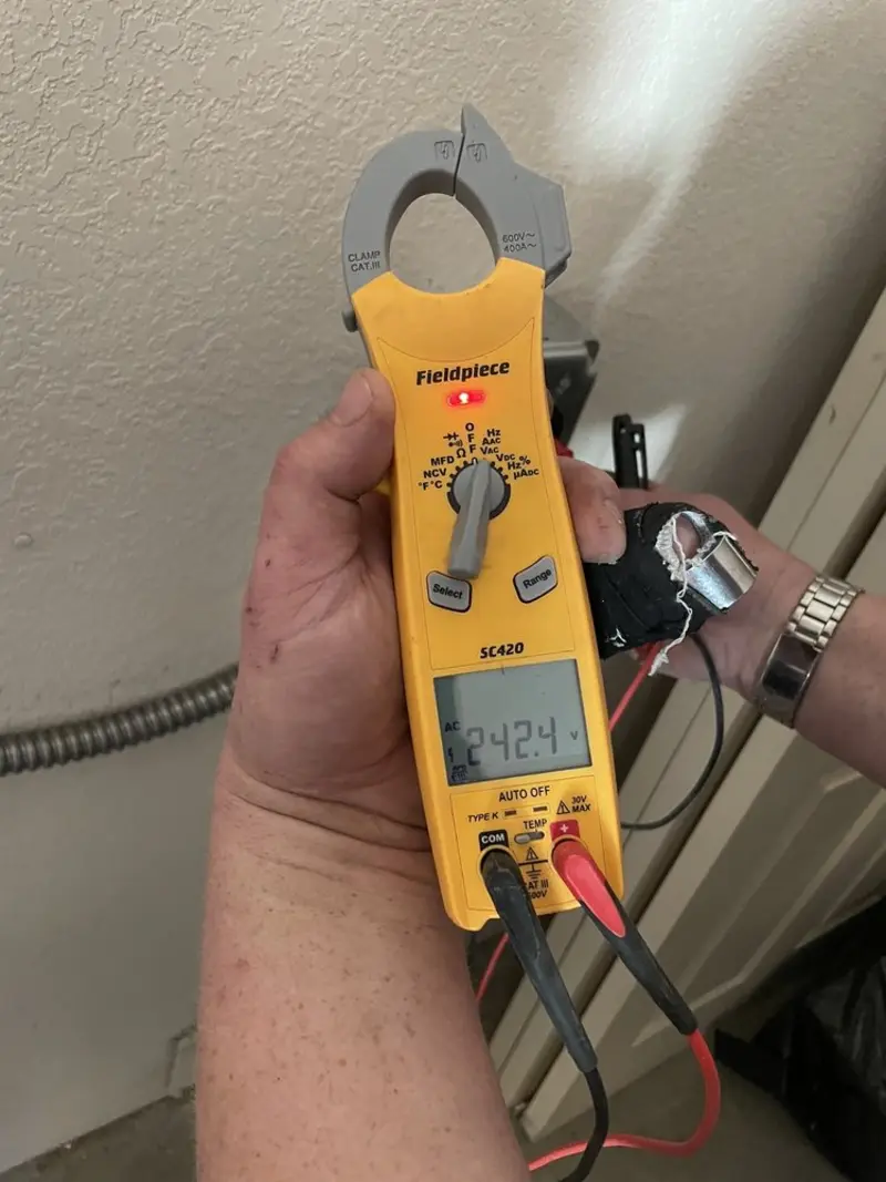 Voltage testing with clamp meter during Outlet Installation in Ridgefield